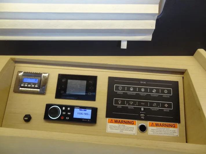 Exit Strategy Yacht Photos Pics Control panel of a 2020 Beneteau Oceanis 46.1 sailboat with various electronic displays.