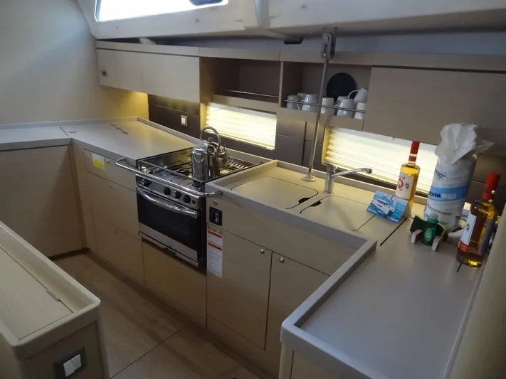 Exit Strategy Yacht Photos Pics Modern kitchen in 2020 Beneteau Oceanis 46.1 yacht with stove, sink, and ample storage.