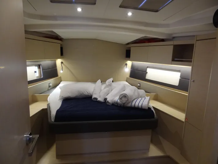 Exit Strategy Yacht Photos Pics Luxurious cabin interior of 2020 Beneteau Oceanis 46.1 yacht with cozy bed.