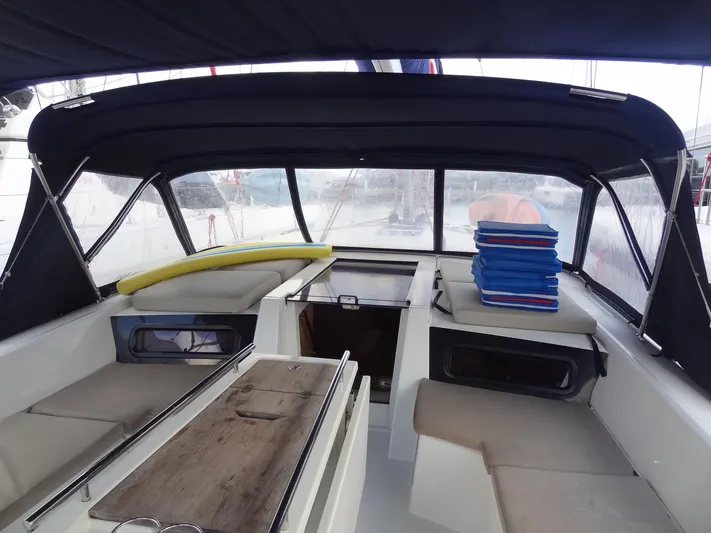 Exit Strategy Yacht Photos Pics Interior cockpit of 2020 Beneteau Oceanis 46.1 sailboat with seating and table.