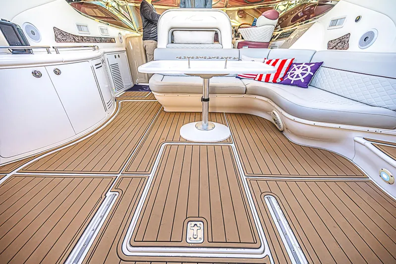 Carolina Girl Yacht Photos Pics Luxurious interior of 2002 Sea Ray 550 Sundancer yacht with elegant seating and table.