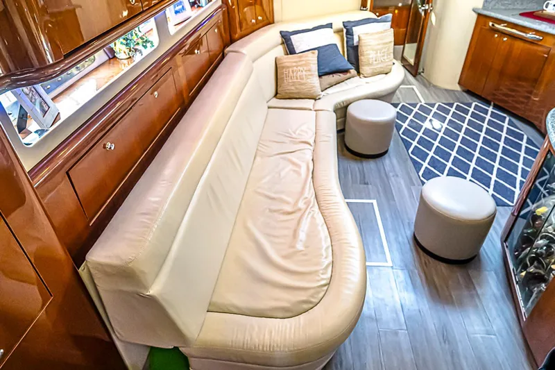 Carolina Girl Yacht Photos Pics Luxurious interior of 2002 Sea Ray 550 Sundancer yacht with plush seating and elegant decor.