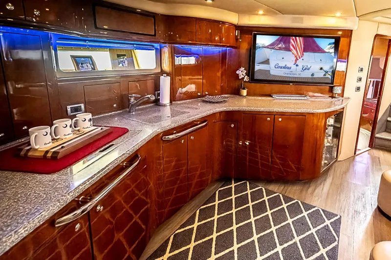 Carolina Girl Yacht Photos Pics Luxurious 2002 Sea Ray 550 Sundancer yacht interior with elegant wood cabinetry and modern amenities.