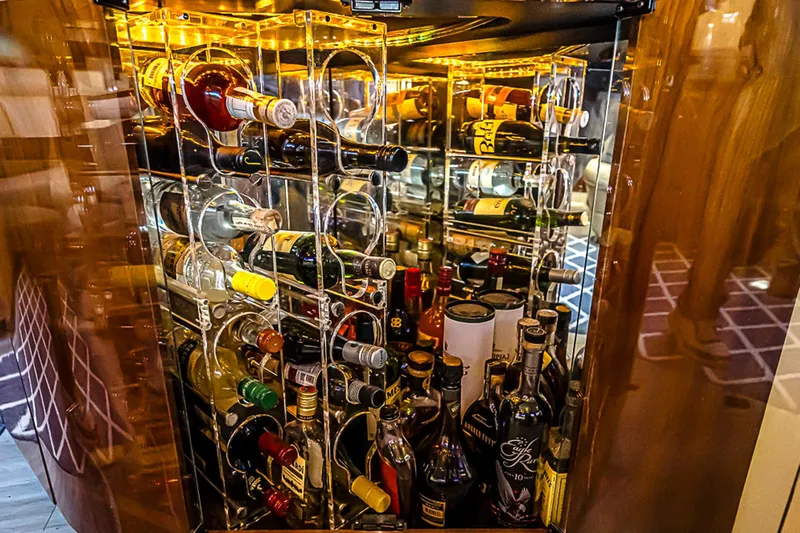 Carolina Girl Yacht Photos Pics Luxurious wine and liquor cabinet aboard 2002 Sea Ray 550 Sundancer yacht.