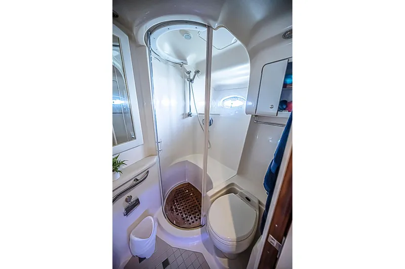 Carolina Girl Yacht Photos Pics Luxurious bathroom in 2002 Sea Ray 550 Sundancer yacht with shower and toilet.