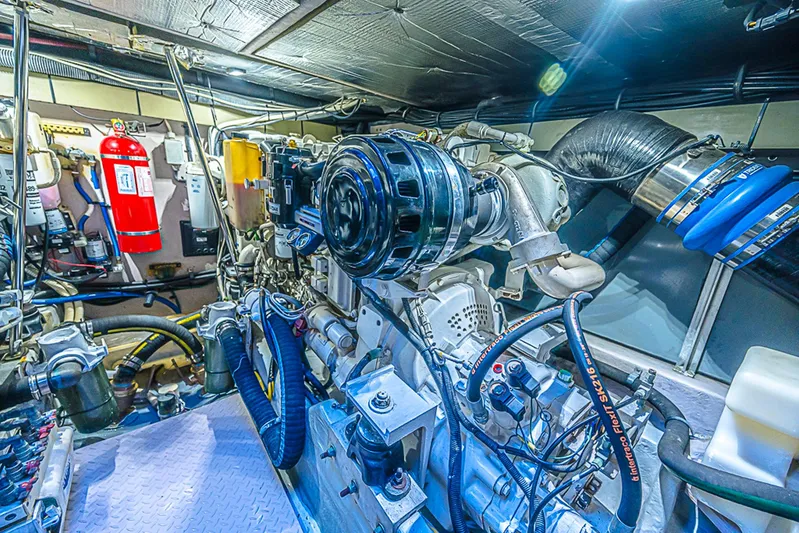 Carolina Girl Yacht Photos Pics Engine room of a 2002 Sea Ray 550 Sundancer yacht, showcasing mechanical components.