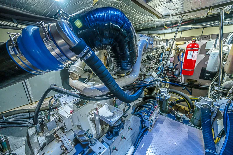 Carolina Girl Yacht Photos Pics Engine room of 2002 Sea Ray 550 Sundancer yacht, showcasing complex machinery and equipment.