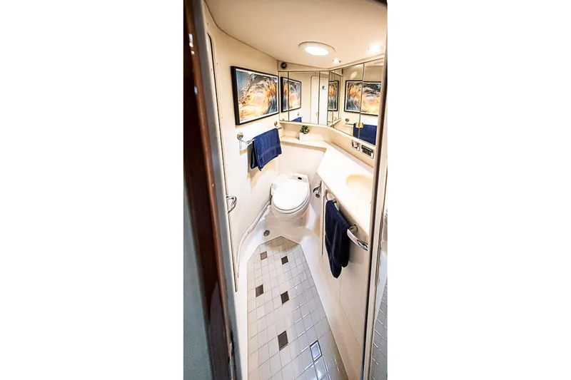 Carolina Girl Yacht Photos Pics Luxurious bathroom in 2002 Sea Ray 550 Sundancer yacht, featuring elegant fixtures and modern design.