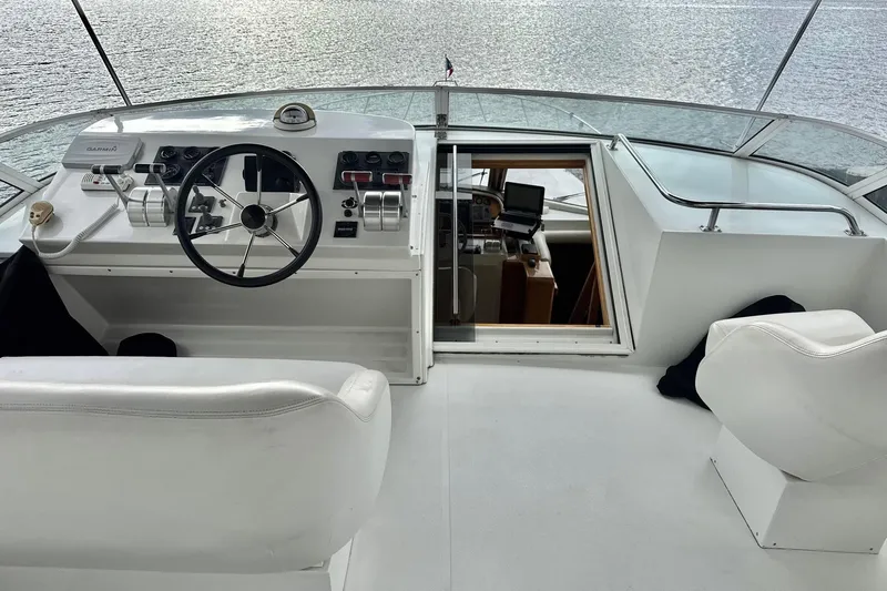  Yacht Photos Pics Pilothouse of 2001 Navigator 56 Classic yacht with steering wheel and controls.