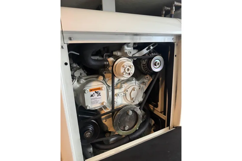  Yacht Photos Pics Engine compartment of 2001 Navigator 56 Classic Pilothouse yacht, showcasing mechanical components.