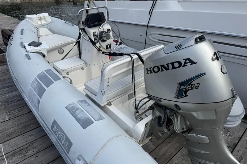  Yacht Photos Pics Inflatable boat with Honda outboard motor, docked beside Navigator 56 Classic Pilothouse, 2001 model.