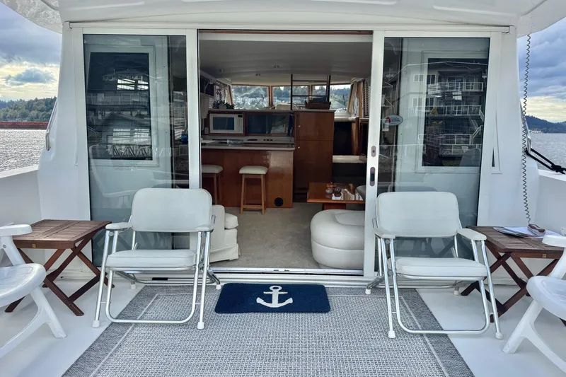  Yacht Photos Pics 2001 Navigator 56 Classic Pilothouse yacht interior with seating and scenic water view.