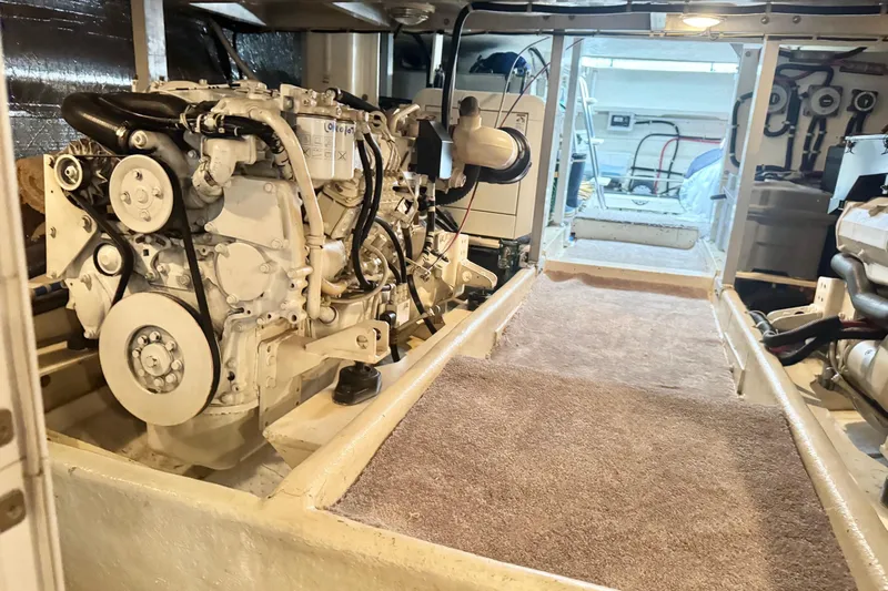  Yacht Photos Pics Engine room of 2001 Navigator 56 Classic Pilothouse yacht, showcasing machinery and equipment.