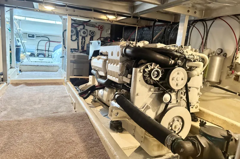  Yacht Photos Pics Engine room of 2001 Navigator 56 Classic Pilothouse yacht, showcasing detailed machinery.