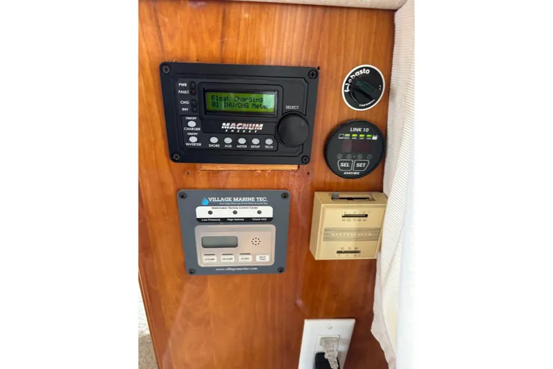  Yacht Photos Pics Control panel of a 2001 Navigator 56 Classic Pilothouse yacht, featuring various gauges and meters.