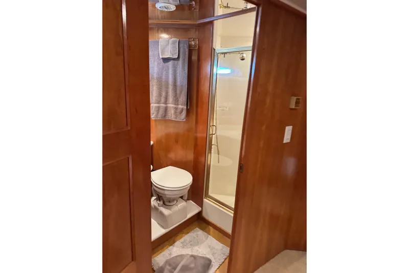  Yacht Photos Pics Bathroom interior of 2001 Navigator 56 Classic Pilothouse yacht with shower and toilet.
