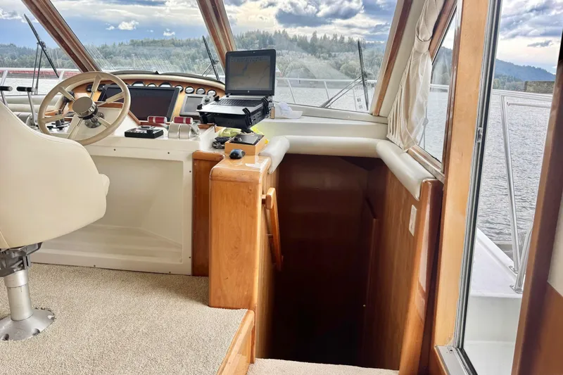  Yacht Photos Pics Navigator 56 Classic Pilothouse 2001 interior with helm, steering wheel, and navigation equipment.