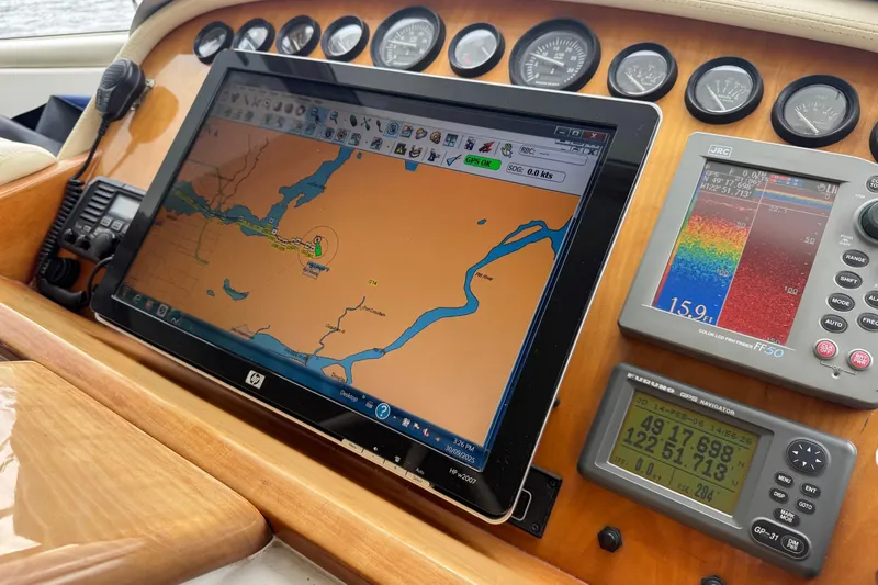  Yacht Photos Pics Pilothouse navigation system with GPS and sonar on 2001 Navigator 56 Classic yacht.