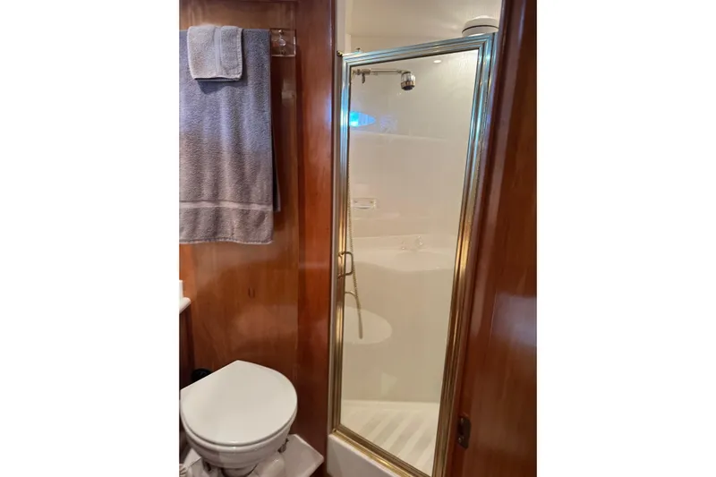  Yacht Photos Pics Bathroom with shower in 2001 Navigator 56 Classic Pilothouse yacht.