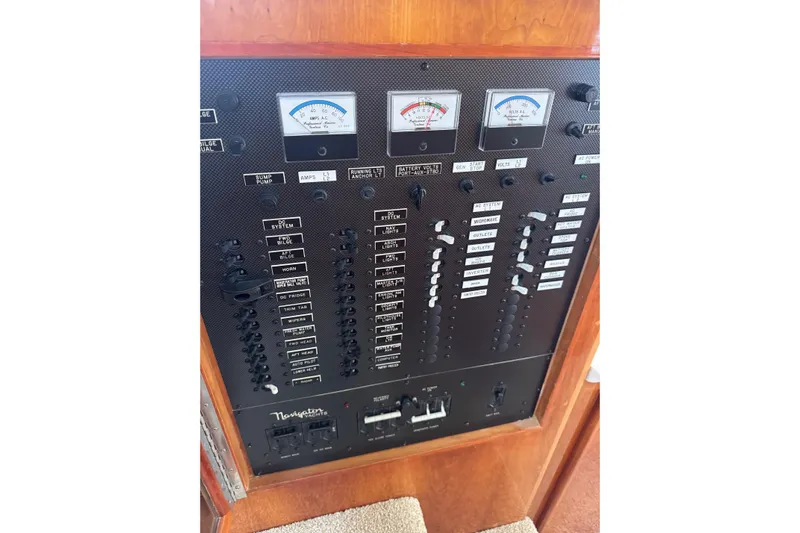  Yacht Photos Pics Electrical control panel of 2001 Navigator 56 Classic Pilothouse yacht with gauges and switches.