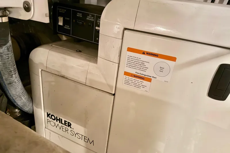  Yacht Photos Pics Kohler power system in 2001 Navigator 56 Classic Pilothouse, featuring warning labels.