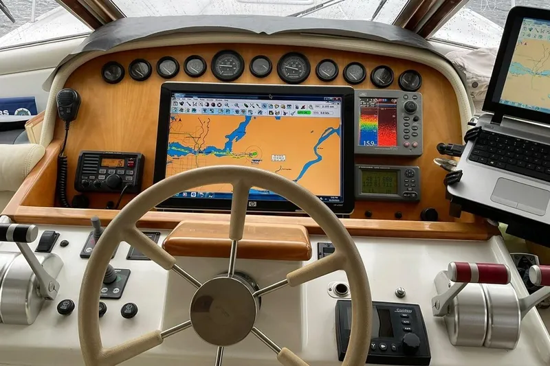  Yacht Photos Pics Pilothouse of 2001 Navigator 56 Classic with navigation equipment and steering wheel.