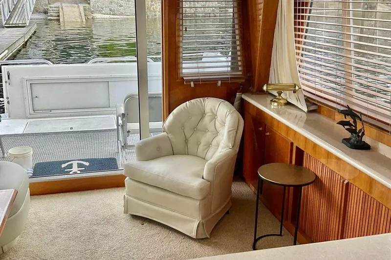  Yacht Photos Pics Interior of 2001 Navigator 56 Classic Pilothouse with plush chair and elegant decor.
