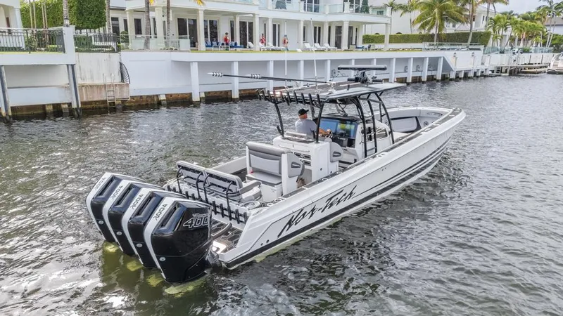  Yacht Photos Pics 2024 Nor-Tech 392 Super Fish boat with quad engines on a calm waterway.