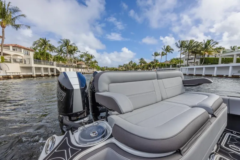  Yacht Photos Pics 2024 Nor-Tech 392 Super Fish boat with luxurious seating on a scenic waterway.