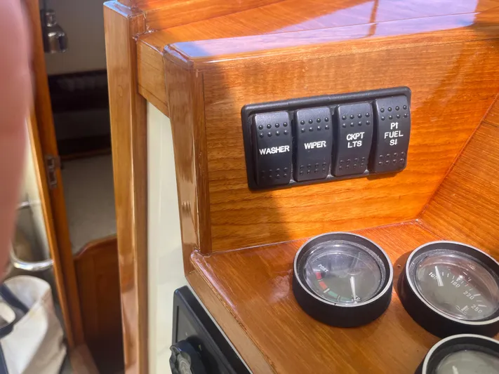  Yacht Photos Pics Control panel of a 1999 Hinckley Picnic boat with switches and gauges.