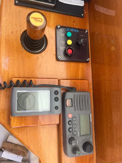  Yacht Photos Pics Hinckley Picnic 1999 boat dashboard with joystick, controls, and communication devices.