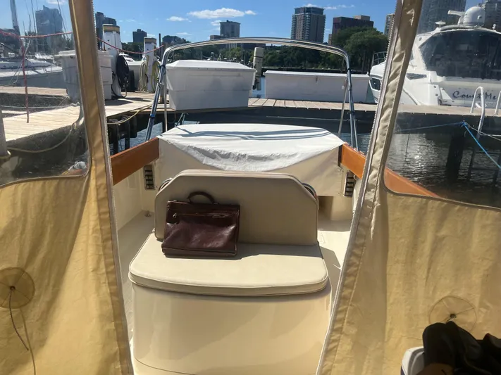  Yacht Photos Pics 1999 Hinckley Picnic boat interior with leather bag, docked at marina.