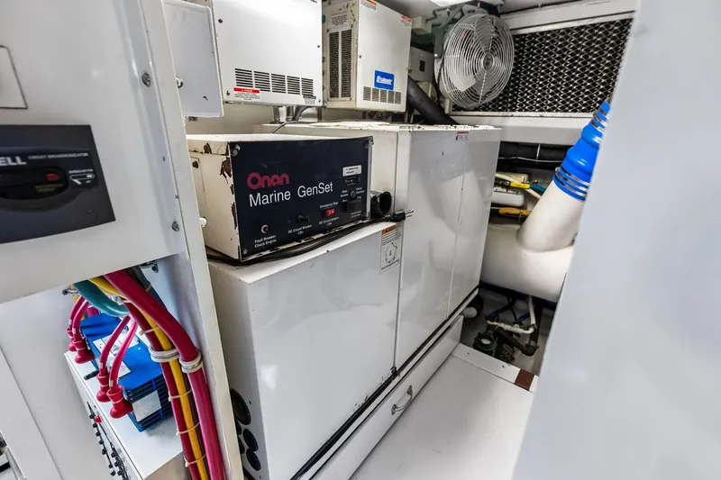 Bombshell Yacht Photos Pics Engine room of 2003 Hatteras 65 Convertible with Onan Marine GenSet generator.