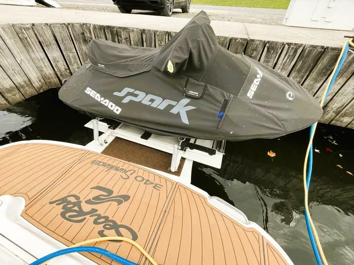  Yacht Photos Pics 2005 Sea Ray 340 Sundancer docked with covered Sea-Doo Spark nearby.