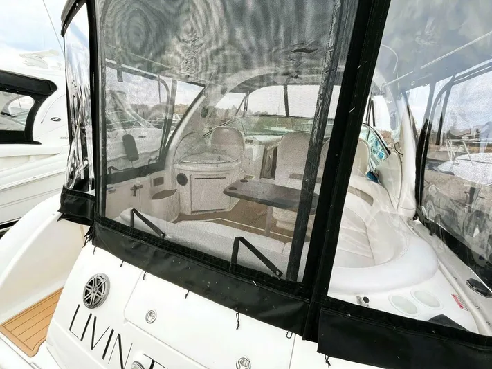  Yacht Photos Pics 2005 Sea Ray 340 Sundancer boat with enclosed cockpit and seating area.