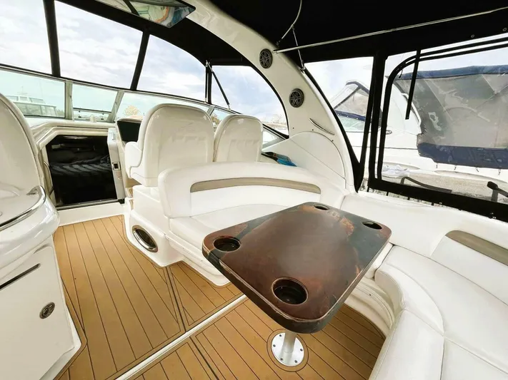  Yacht Photos Pics Interior of 2005 Sea Ray 340 Sundancer yacht with seating and table.