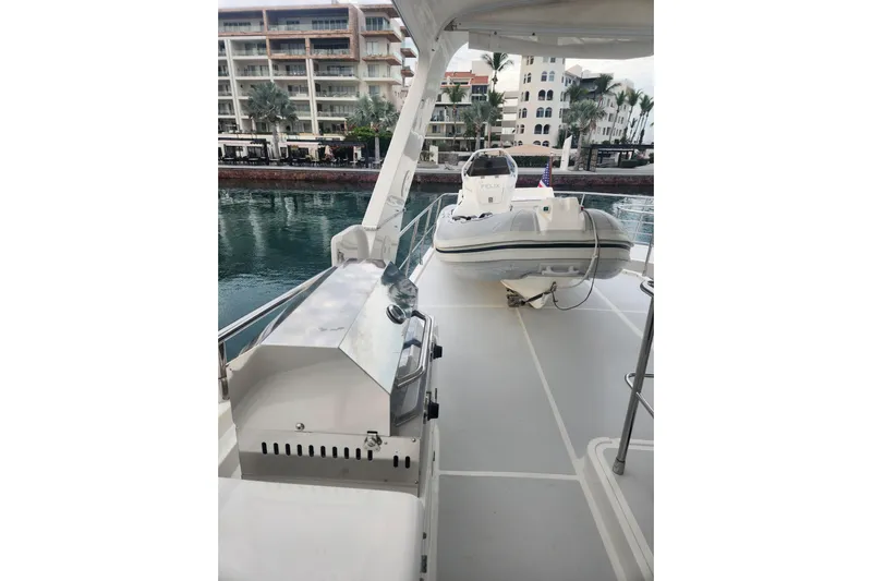 Felix Yacht Photos Pics Deck view of 2008 Selene 53 Ocean Classic yacht with tender and waterfront buildings.