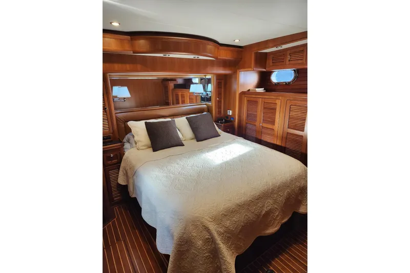 Felix Yacht Photos Pics Luxurious bedroom interior of 2008 Selene 53 Ocean Classic yacht with wooden finishes.
