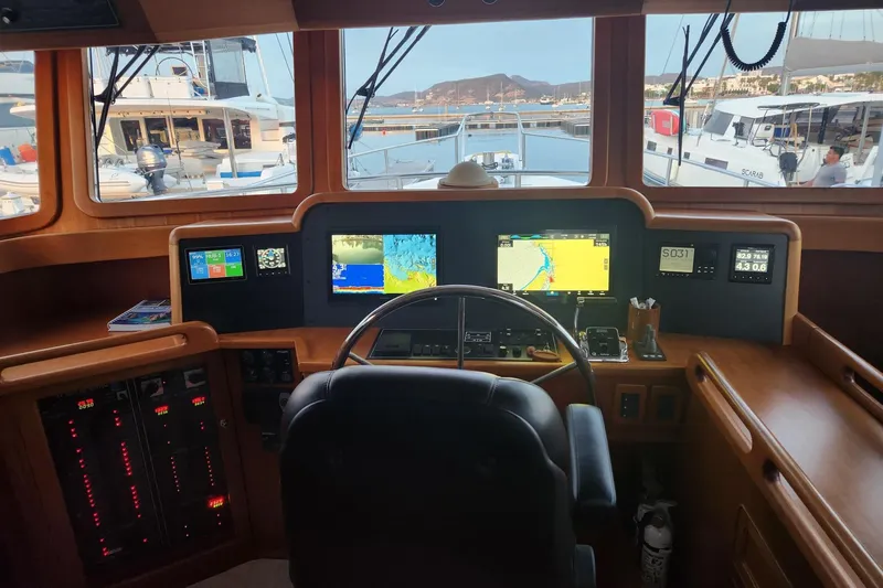 Felix Yacht Photos Pics Helm of 2008 Selene 53 Ocean Classic yacht with navigation screens and controls.