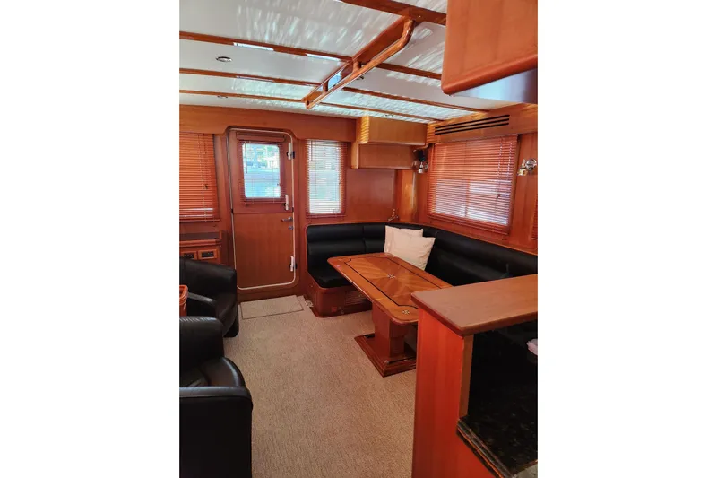 Felix Yacht Photos Pics Interior of 2008 Selene 53 Ocean Classic yacht with wooden furnishings and seating area.
