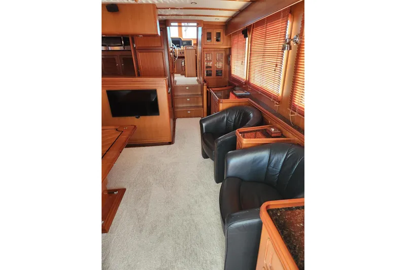 Felix Yacht Photos Pics Luxurious interior of 2008 Selene 53 Ocean Classic yacht with leather chairs and wood finishes.