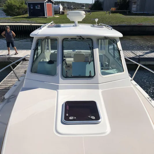 Intermission Yacht Photos Pics 2006 Back Cove 29 boat docked, showcasing cabin and deck features.