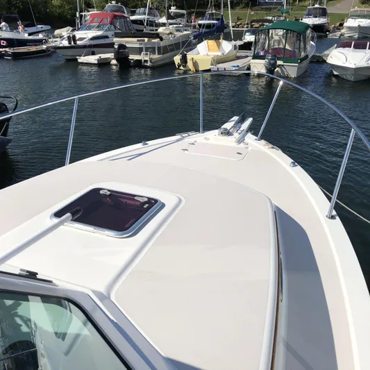 Intermission Yacht Photos Pics 2006 Back Cove 29 boat docked in a marina with other vessels.