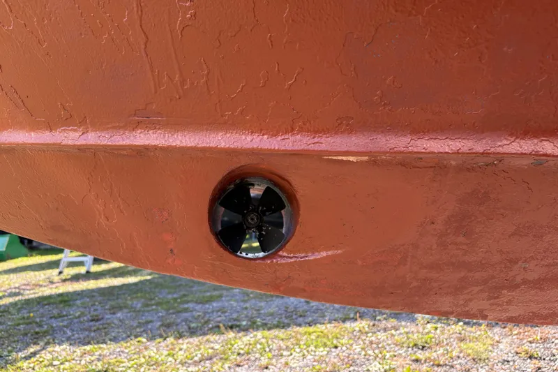 Intermission Yacht Photos Pics 2006 Back Cove 29 boat hull with visible thruster, showing textured surface.