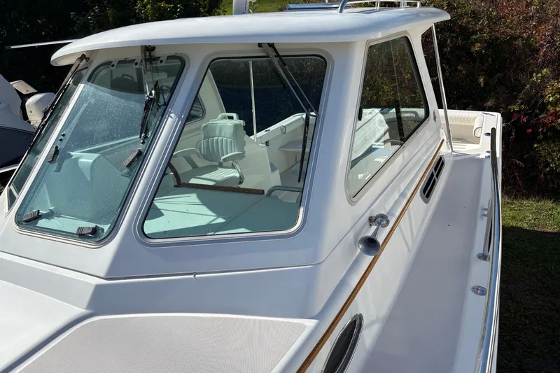 Intermission Yacht Photos Pics 2006 Back Cove 29 boat with white cabin and sleek design, docked outdoors.