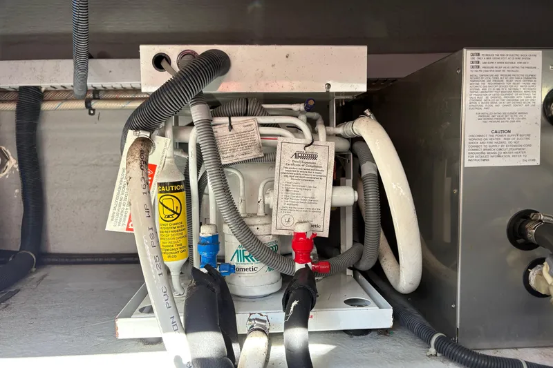 Intermission Yacht Photos Pics 2006 Back Cove 29 engine compartment with wiring and labels.