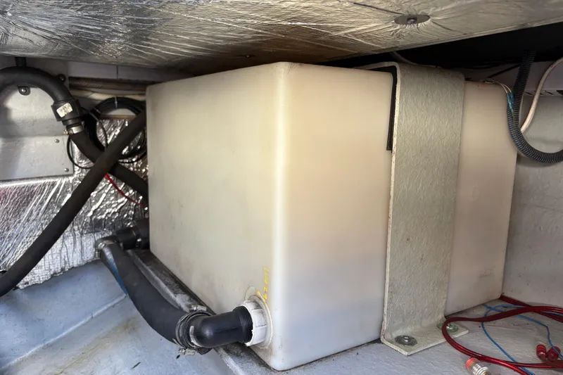 Intermission Yacht Photos Pics 2006 Back Cove 29 boat engine compartment with storage tank and wiring.