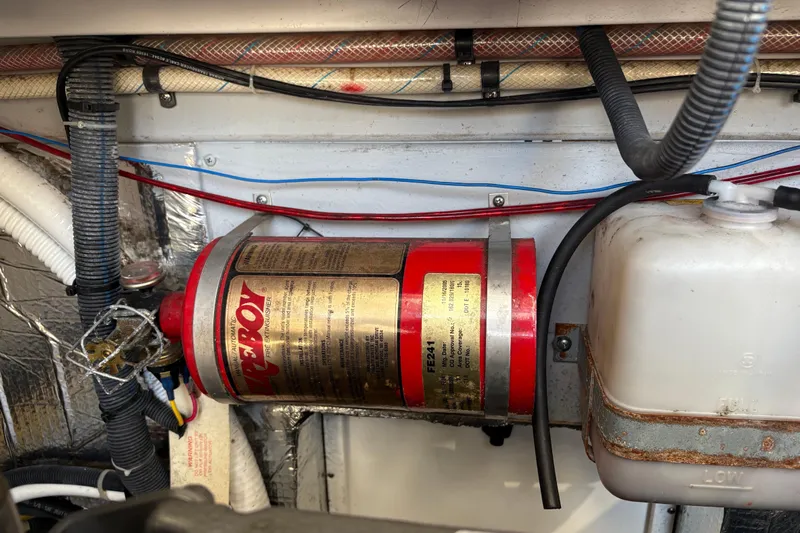 Intermission Yacht Photos Pics Engine compartment of a 2006 Back Cove 29 boat with fire extinguisher and wiring.