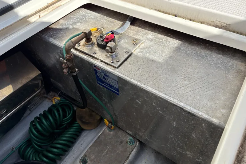 Intermission Yacht Photos Pics Fuel tank compartment of a 2006 Back Cove 29 boat with hoses and fittings.