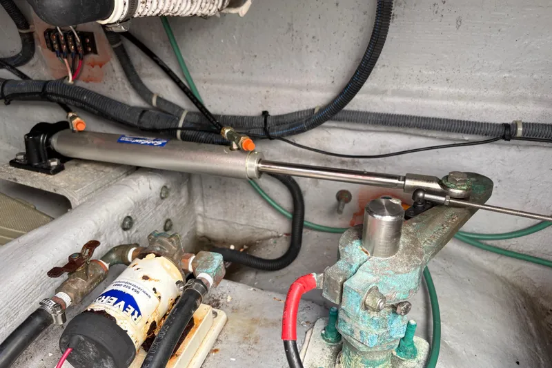 Intermission Yacht Photos Pics 2006 Back Cove 29 boat engine compartment with hydraulic steering components and wiring.